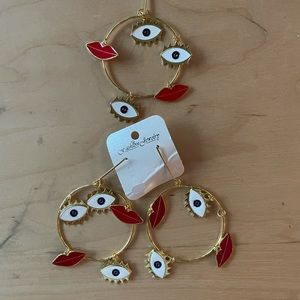 Gold eye and lip earrings